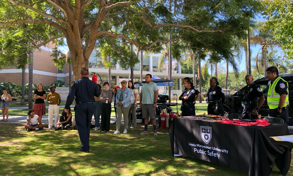 Officer giving a safety demonstration to students