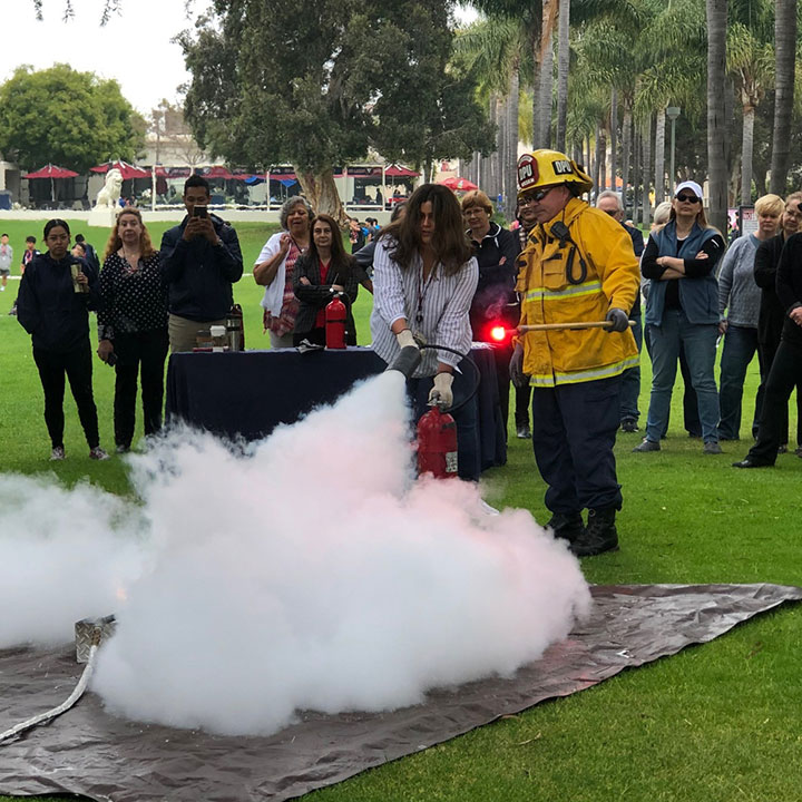 A group of staff attending a fire safety training in Alumni Mall